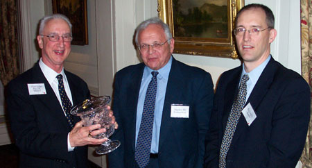 The Honorable Paul R. Michel (left), Chief Judge of the Court of Appeals for the Federal Circuit, receiving the 2005 Eli Whitney Award from Stanley Lieberstein (center) and CIPLA President Richard Basile (right), May 11th, 2005.